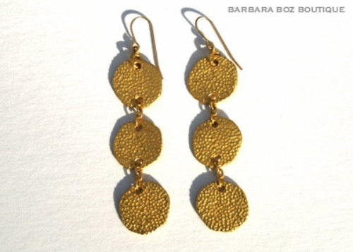 top view of organic-shaped gold earrings