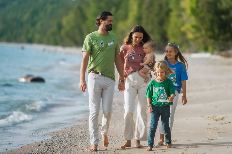 family wearing witty word play t-shirts depicting moor vs more