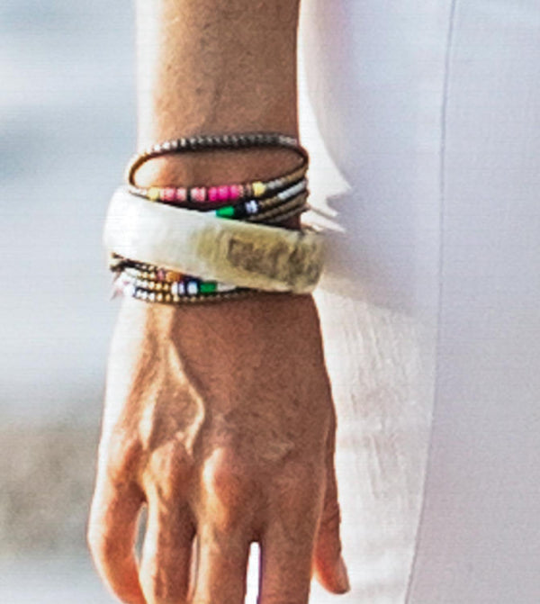 model wearing heishi bead bracelet comprising pyrite and metallics