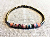 heishi bead bracelet comprising vinyl discs in a peach multi mix and metallic beads