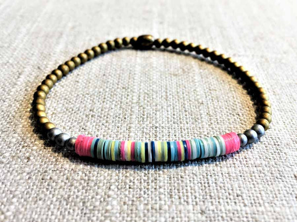 heishi bead bracelet comprising vinyl discs in a pink multi mix and metallic beads