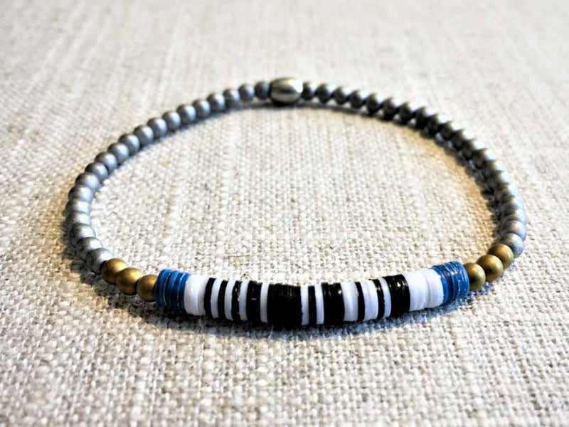 heishi bead bracelet comprising vinyl discs in a black and white mix and metallic beads