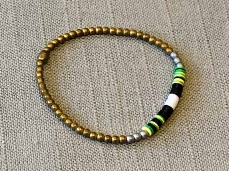 heishi bead bracelet comprising vinyl discs in a black and white racing stripe and metallic beads