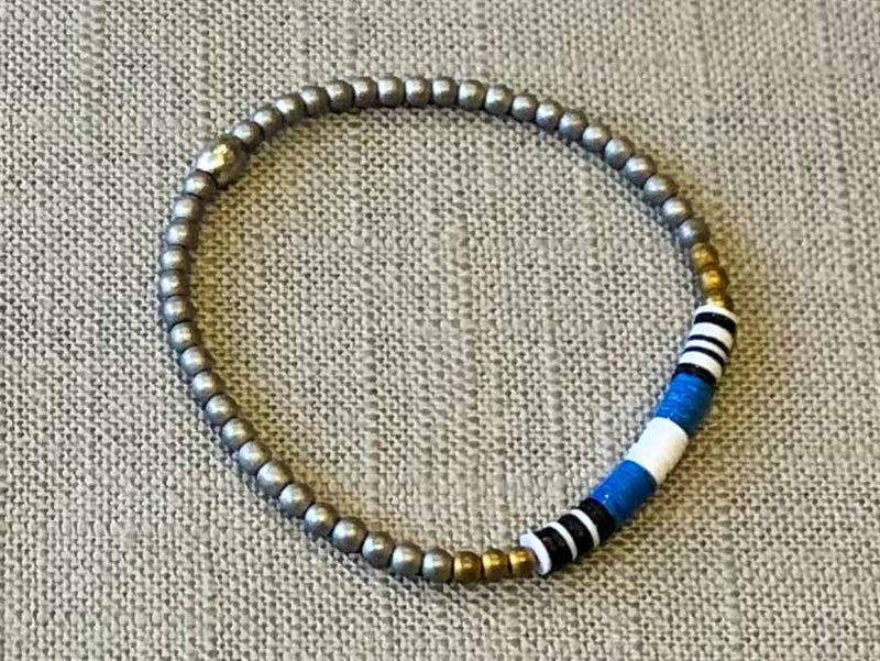 heishi bead bracelet comprising vinyl discs in a blue and white racing stripe and metallic beads