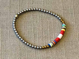 heishi bead bracelet comprising vinyl discs in a red and white racing stripe and metallic beads