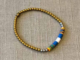 heishi bead bracelet comprising vinyl discs in a blue and white racing stripe and metallic beads