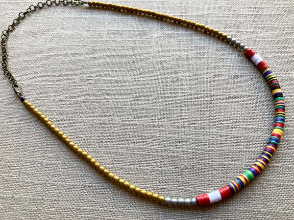 heishi necklace comprising vinyl discs in a red multi mix and metallic beads