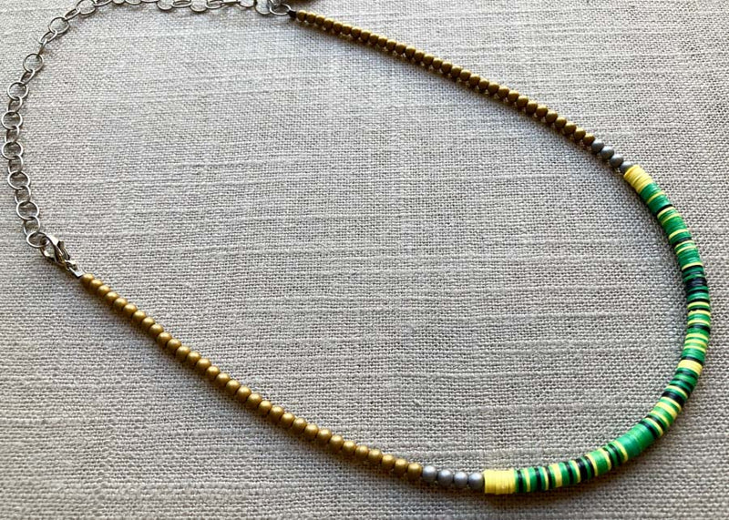 heishi necklace comprising vinyl discs in a green multi mix and metallic beads