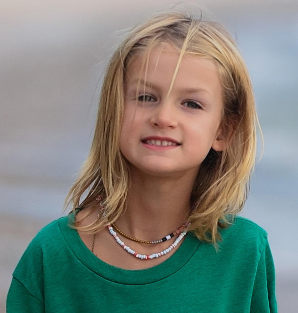 model wearing colorful heishi necklace