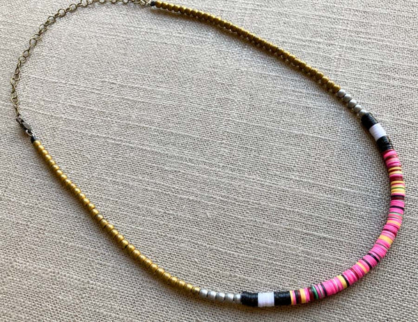 heishi necklace comprising vinyl discs in a pink multi mix and metallic beads