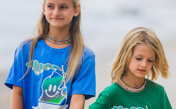 models wearing colorful heishi necklaces