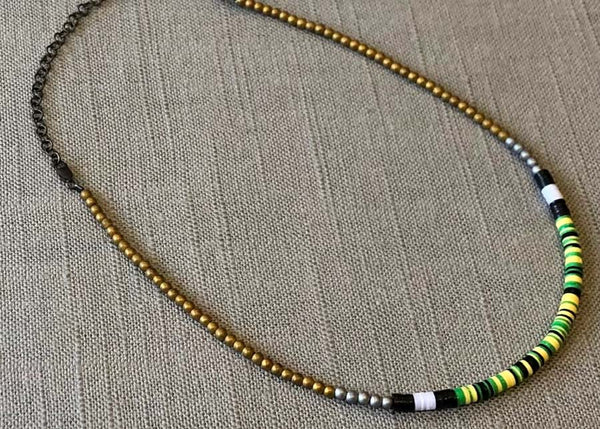 heishi necklace comprising vinyl discs in a green multi mix and metallic beads