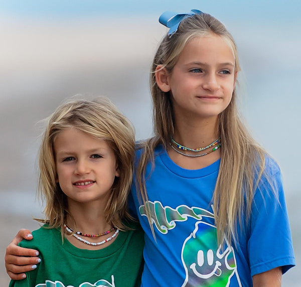 models wearing colorful heishi necklaces