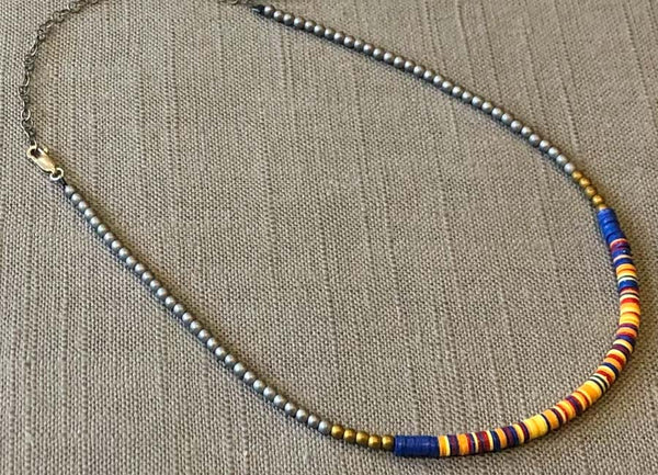 heishi necklace comprising vinyl discs in a yellow multi mix and metallic beads