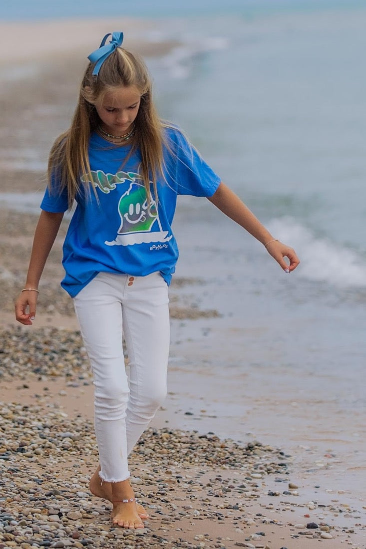 young girl wearing lake t-shirt with michigan mr. michi character