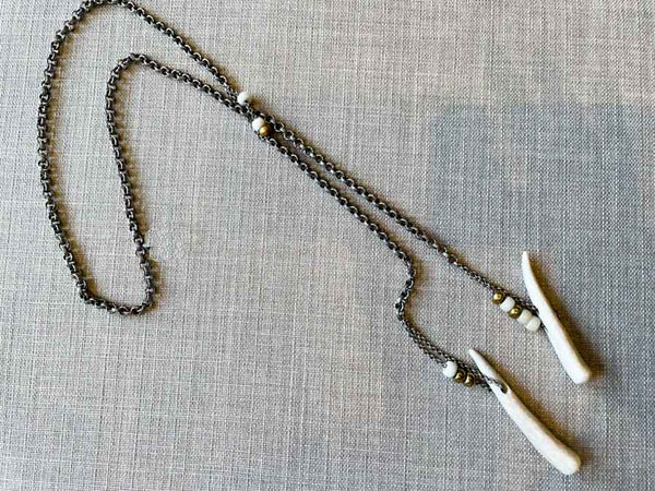 top view of antler lariat on large silver rolo chain