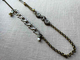 top view of fragment chain necklace with vintage and reclaimed chain elements and various trade beads