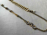 top view of fragment chain necklace with vintage and reclaimed chain elements and various trade beads