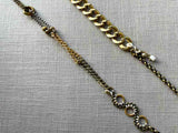 closeup of fragment chain necklace with vintage and reclaimed chain elements and various trade beads