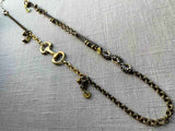 top view of fragment chain necklace with vintage and reclaimed chain elements and various trade beads