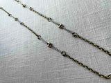 top view of mariner link necklace with mixed metal chain pattern