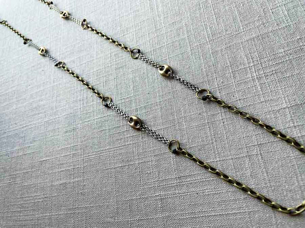 top view of mariner link necklace with mixed metal chain pattern