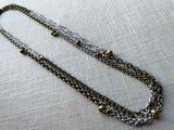 top view of 64"L mixed metal chain necklace with bronze beads