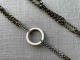 extra closeup of fossil ivory ring necklace with mixed metal chain mix