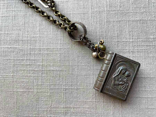 closeup of antique rosary box pendant on chain mix 