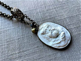 closeup of antique carved cameo pendant (Hercules) on chain mix