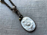 closeup of antique carved cameo pendant (Hercules) on chain mix