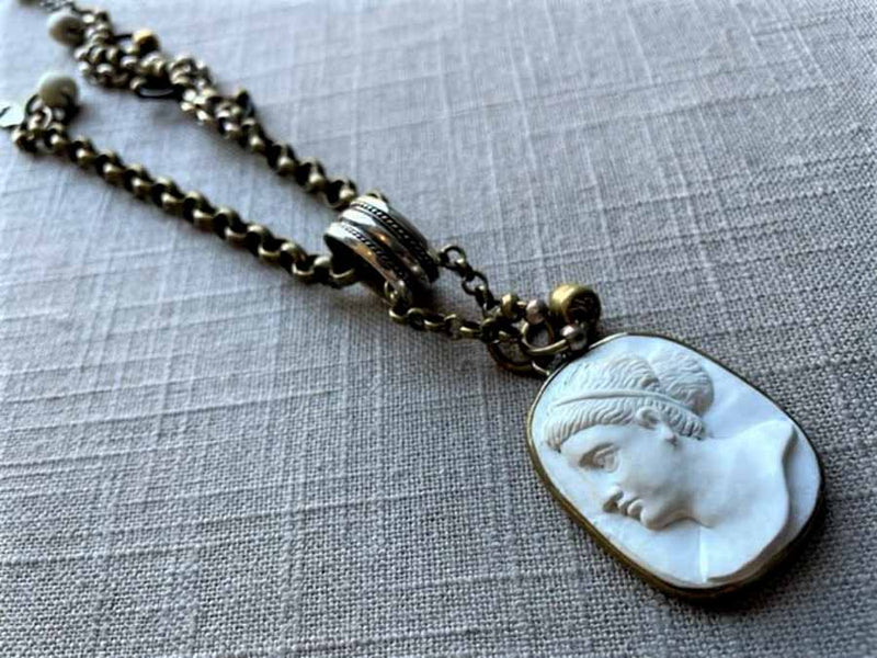 closeup of antique carved cameo pendant (Aphrodite) on chain mix