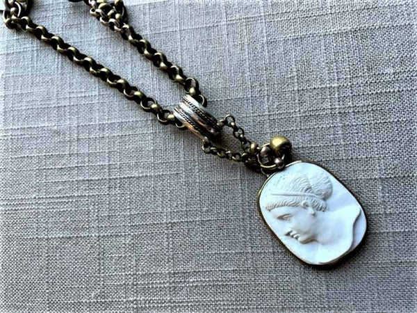 closeup of antique carved cameo pendant (Aphrodite) on chain mix