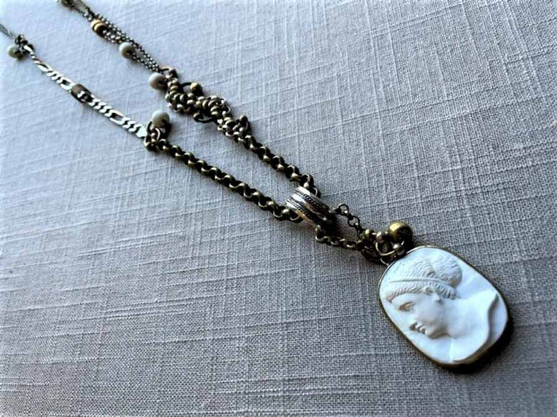 top view of antique carved cameo pendant (Aphrodite) on chain mix