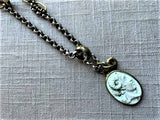 closeup of antique carved cameo pendant (Alexander the Great) on chain mix