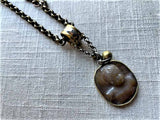 closeup of antique carved cameo pendant (eros) on chain mix