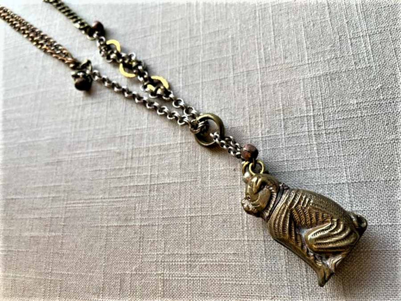 top view of antique bronze match safe pendant (bulldog) on chain mix