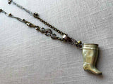 top view of antique silver-plate match safe (boot) pendant on chain mix