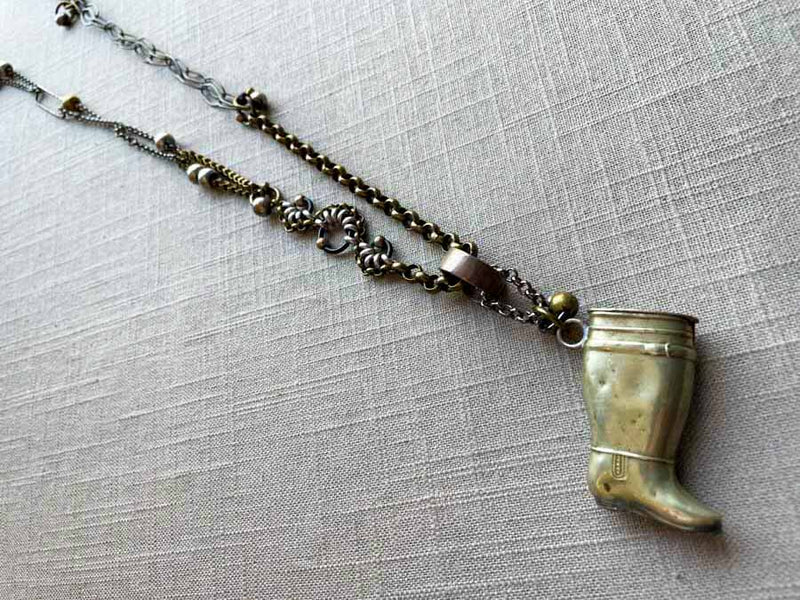 top view of antique silver-plate match safe (boot) pendant on chain mix