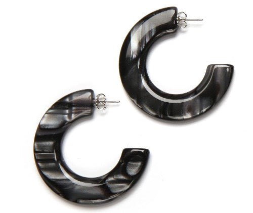 top view of resin earrings in black, white and grey