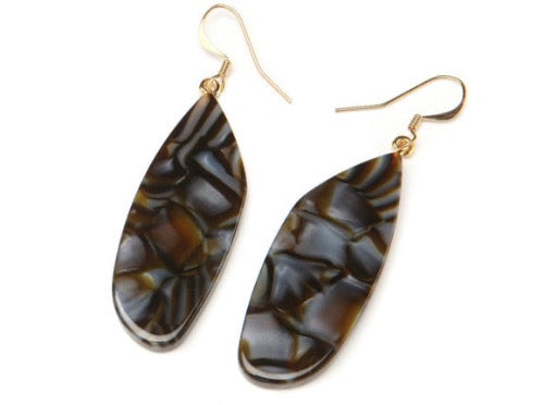 top view of resin earrings in brown and grey