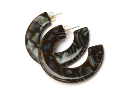 top view of resin earrings in brown and grey