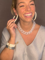 model wearing resin earring in white