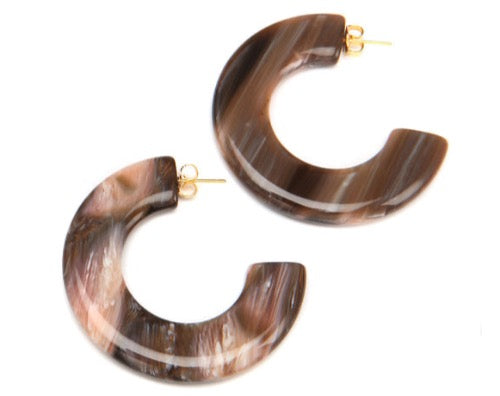 top view of resin earrings in brown tones