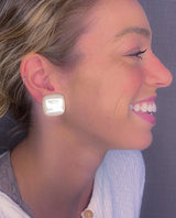 model wearing resin clip earring in pearl