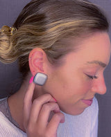 model wearing resin clip earring in matte silver