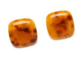 top view of resin clip earrings in honey