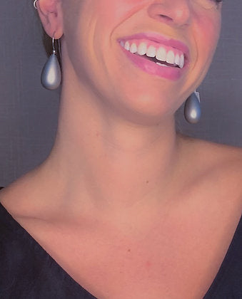 model wearing resin earrings in matte silver