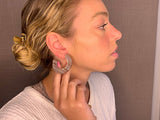 model wearing resin earrings in rose