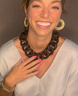 model wearing resin earrings in camel